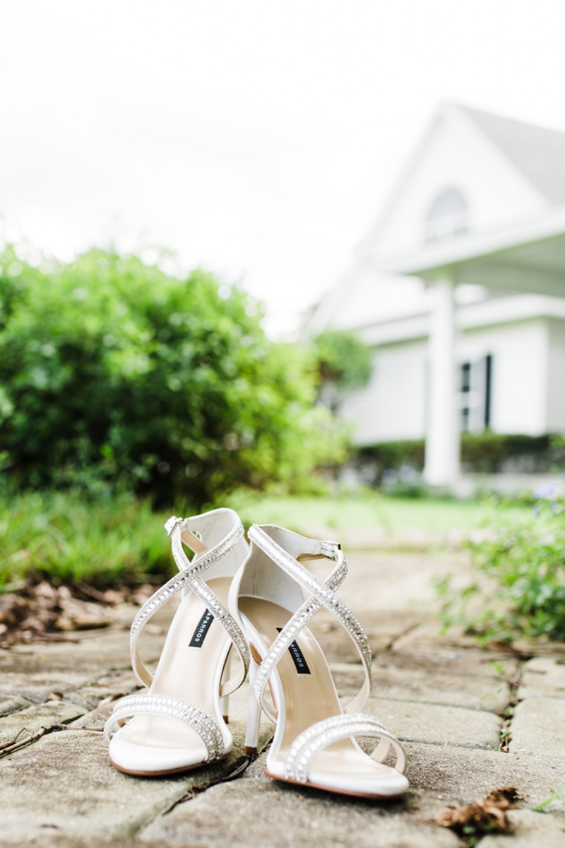 Bridal shoes on cobblestone walkway