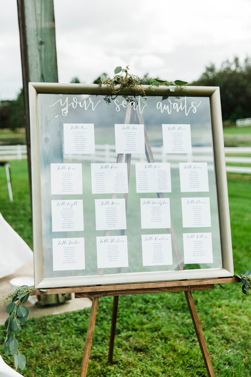 framed escort card display at Bramble Tree Estate wedding