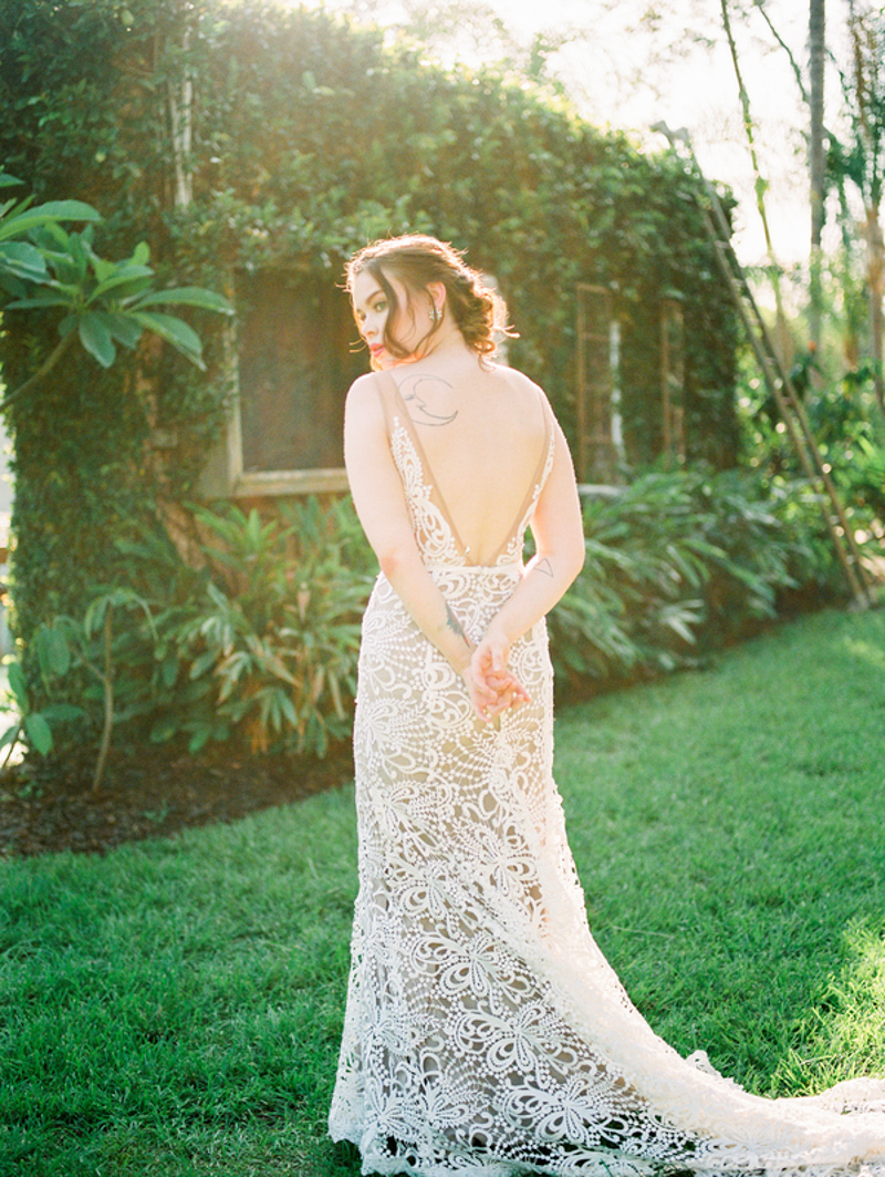 bride in Made With Love gown looking over shoulder