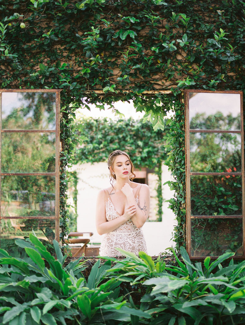 Bride looking out window at The Acre Orlando