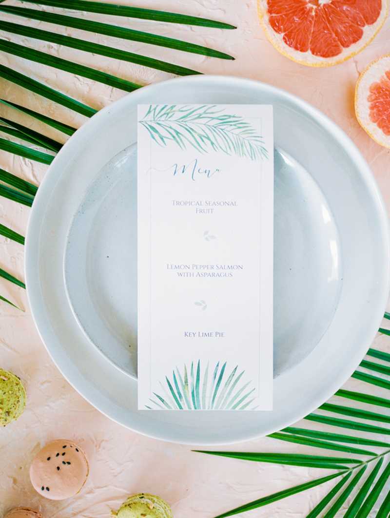 tropical menu card on light blue dinner plate