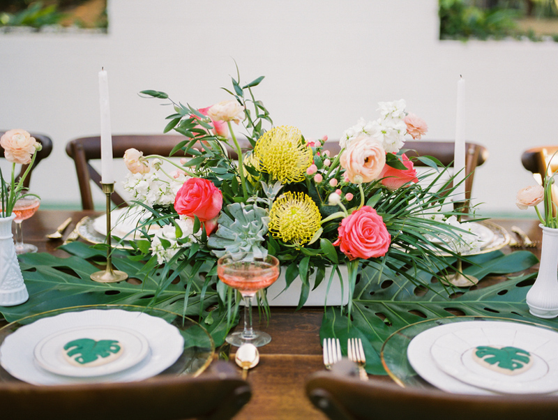 tropical floral centerpiece on farm table