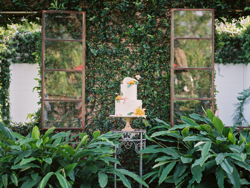tropical wedding cake on side table