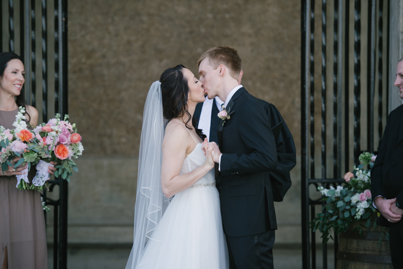 bride and grooms first kiss for wedding ceremony
