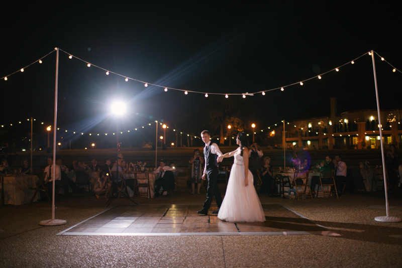 couple's first dance under market lights