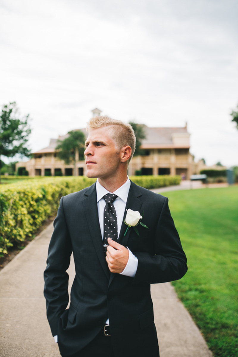 groom looking towards green for Eagle Creek Golf Club wedding