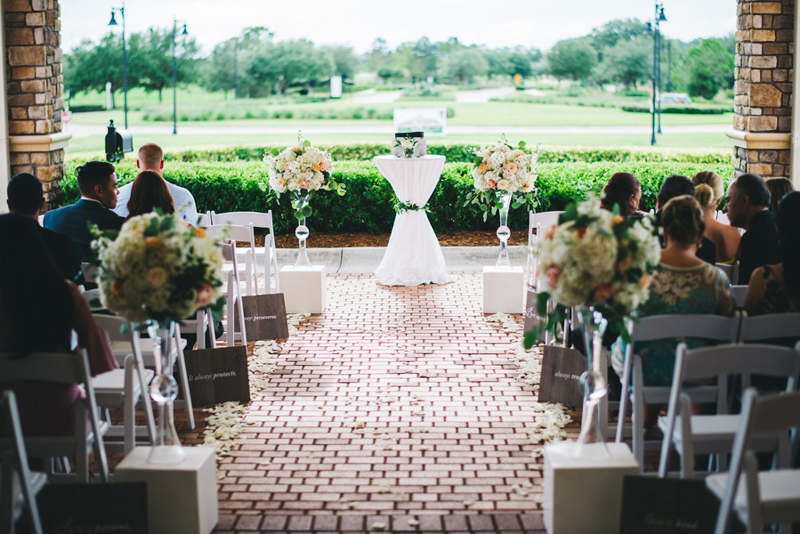 wedding ceremony under Eagle Creek Golf Club canopy