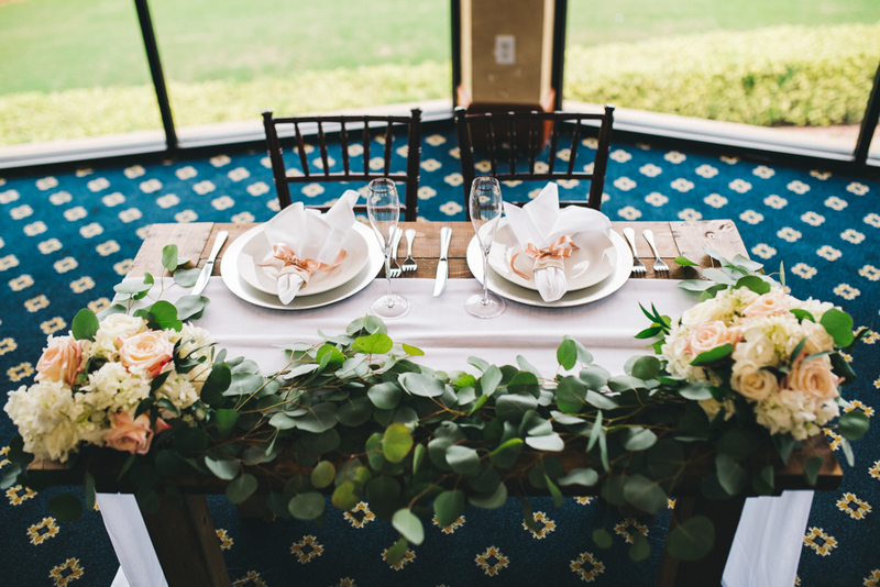 sweetheart farm table with floral garland