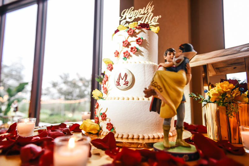 Snow White inspired wedding cake on table