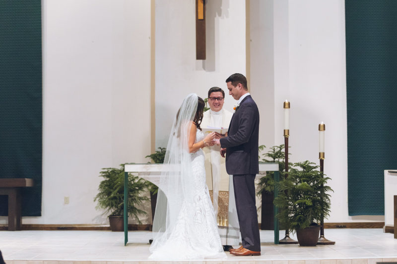 bride and groom exchanging rings