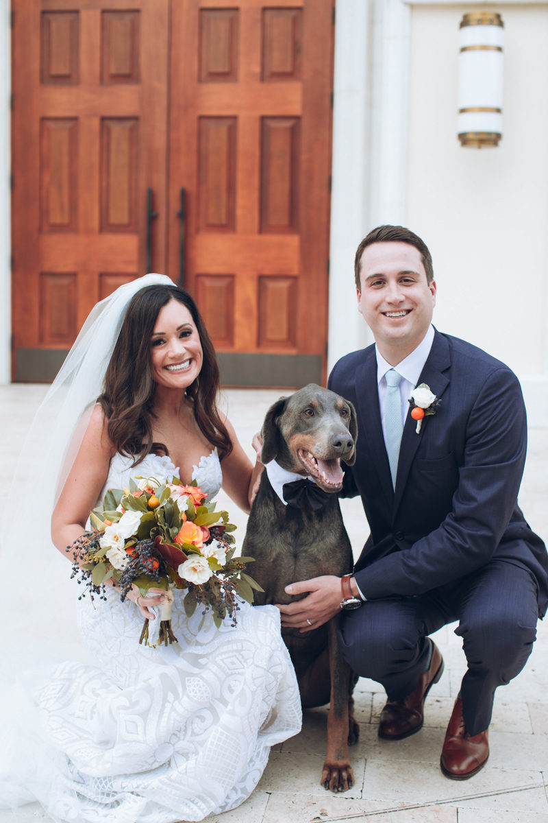 bride and groom with their dog