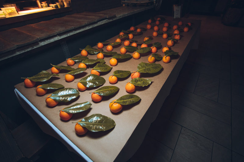 orange leave escort cards for Ravenous Pig wedding