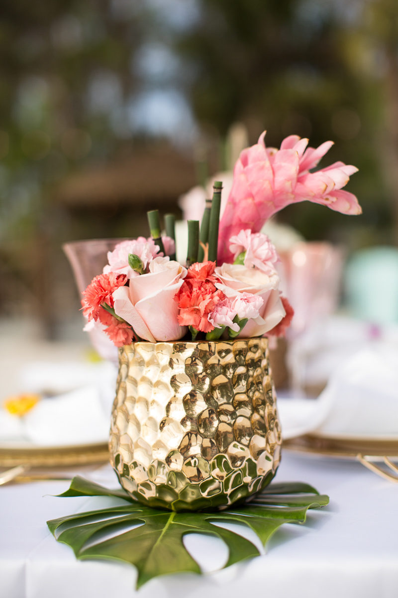tropical wedding table arrangement with bamboo