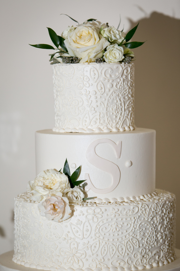 White buttercream wedding cake with swirls