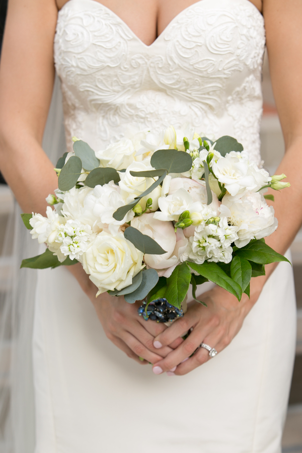 White bridal bouquet with green accents