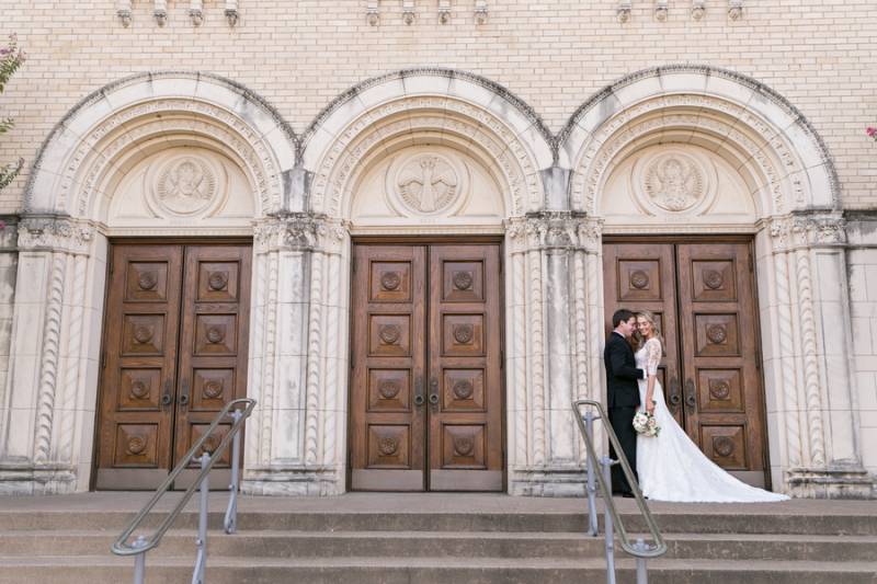 Bride and groom portrait in front of historic church