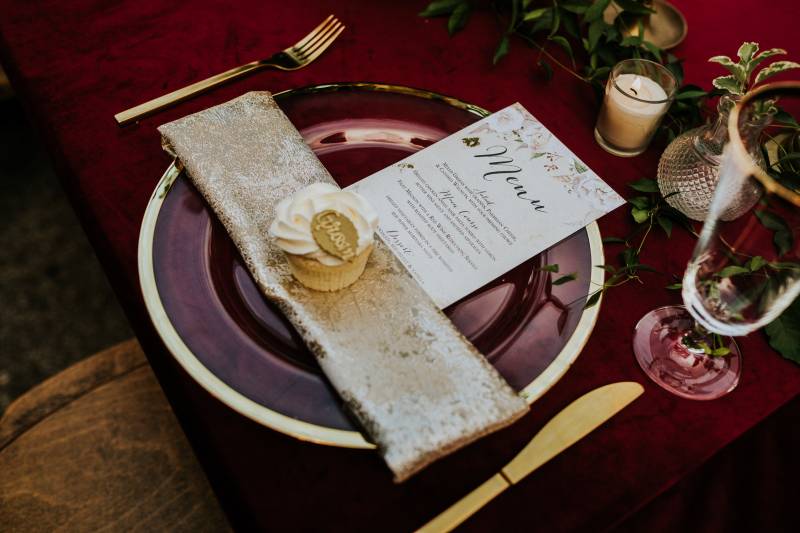 Gold and burgundy place setting