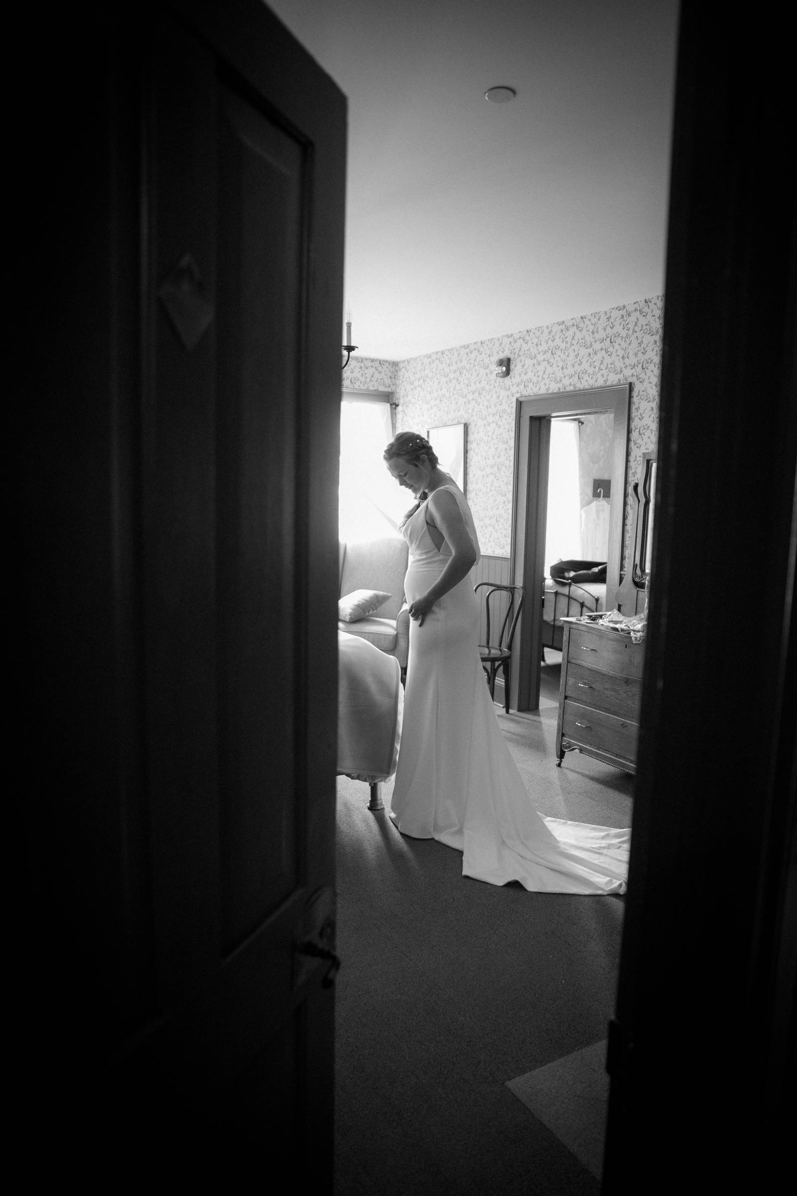 Bride getting ready in vintage room at Fort Steele Heritage Town