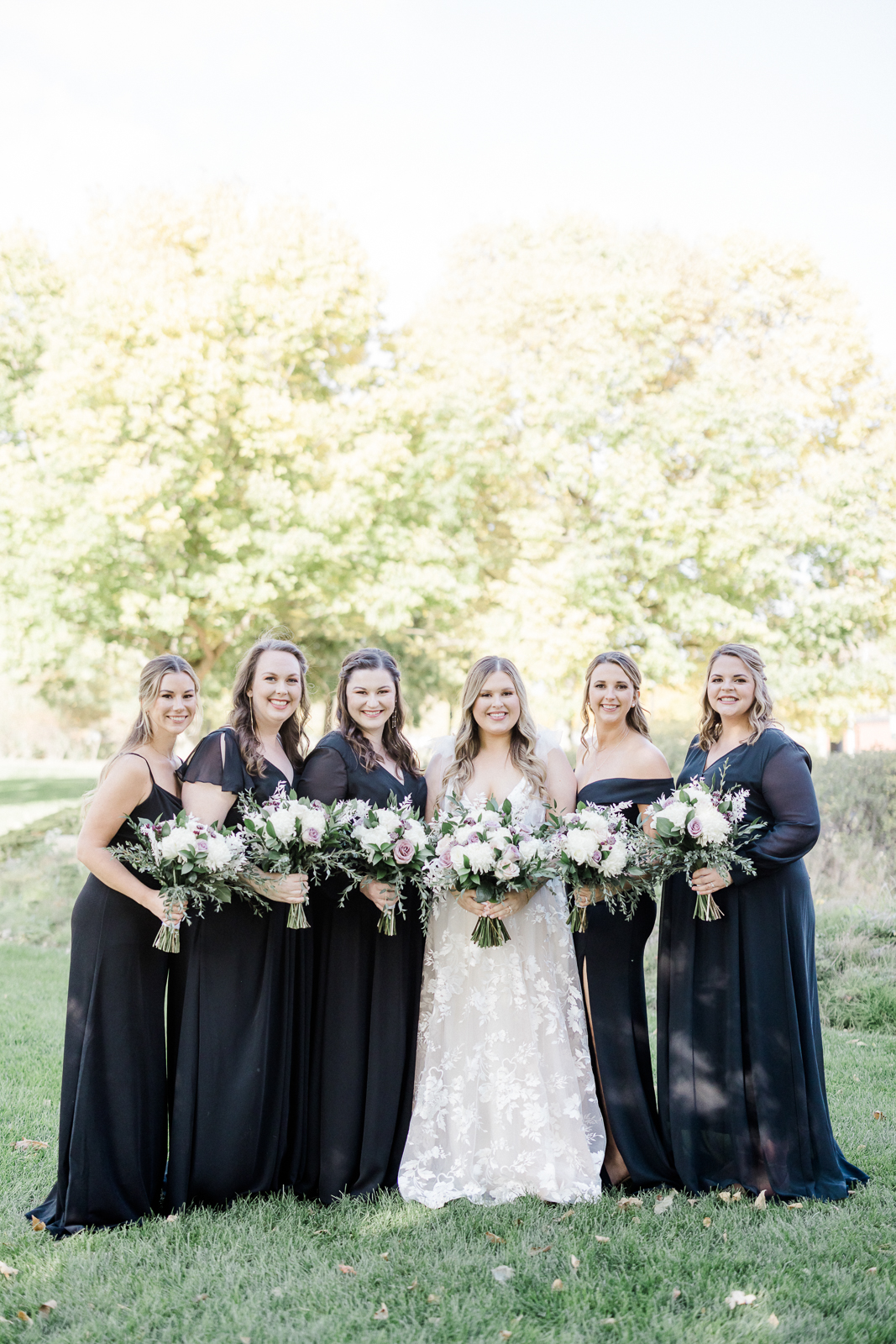 bride and bridesmaids in black dresses