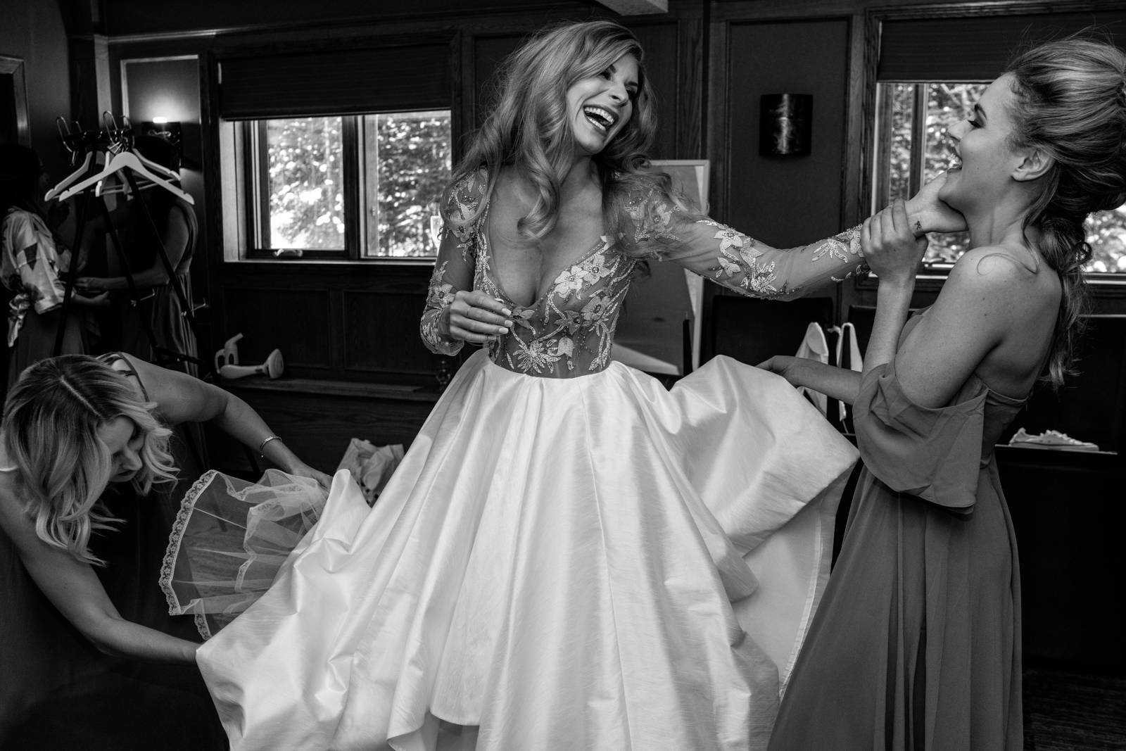 bride putting her wedding dress