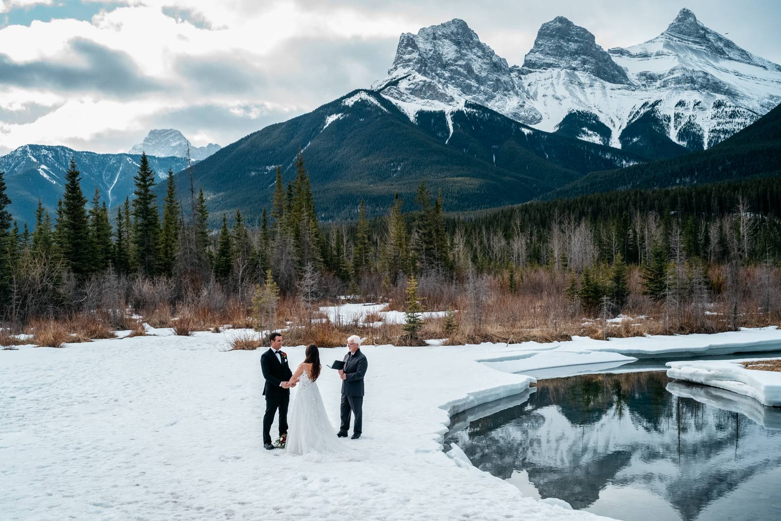 couple holding their hands during elopement ceremony