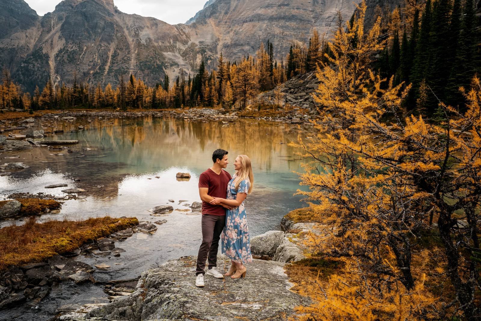 couple hugs in yellow forest