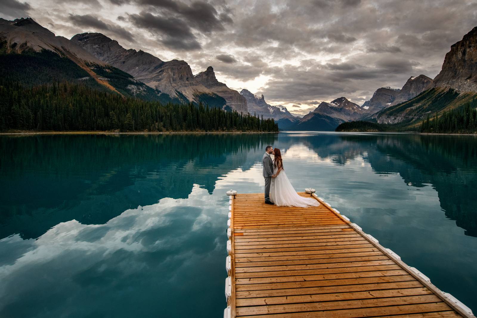 bride and groom kissing at spirit island