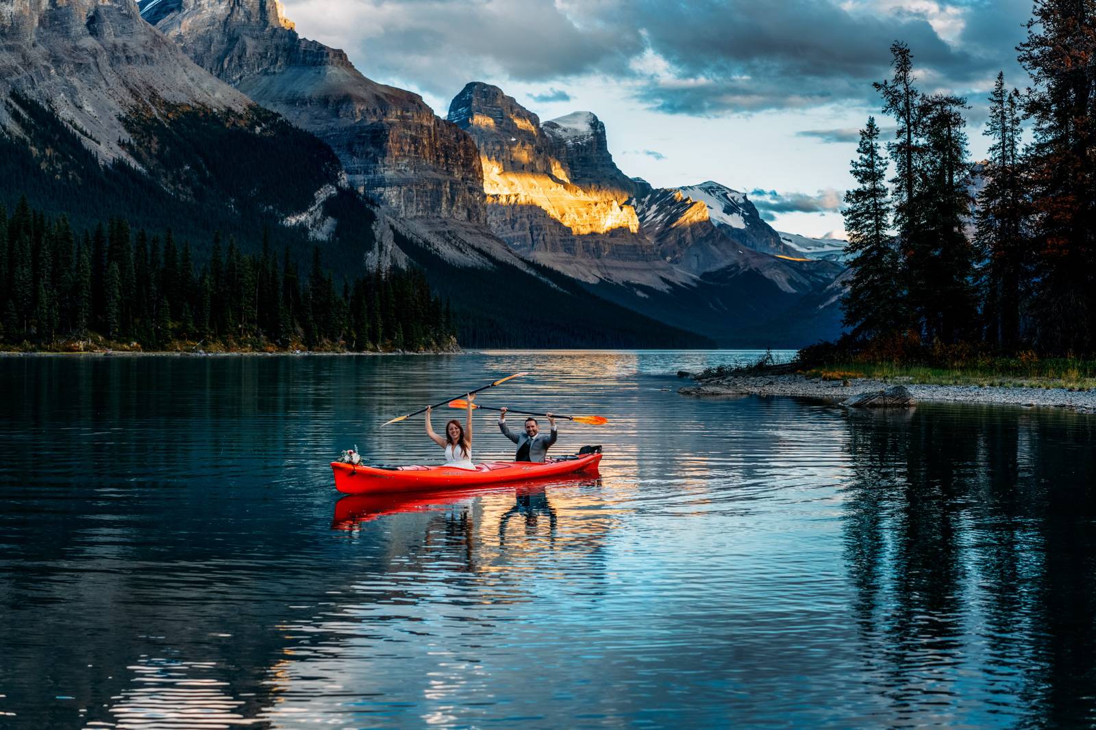 elopement couple having fun kayaking