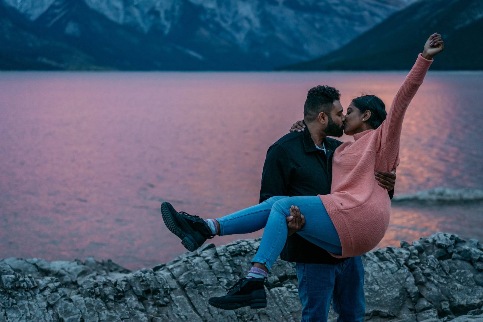 couple having fun at lake minnewanka