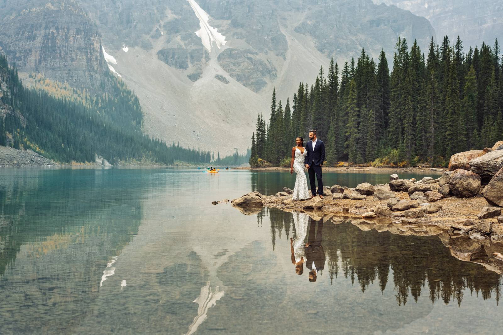 couple standing at moraine lake