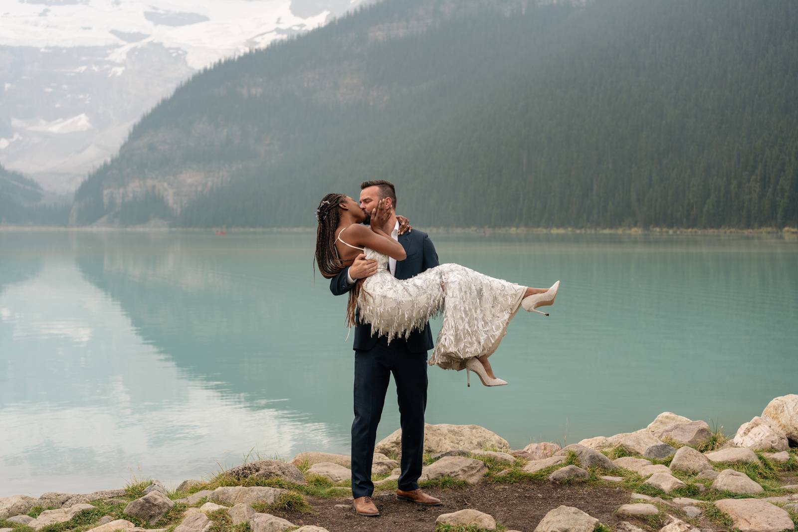 intimate elopement kiss at Lake Louise