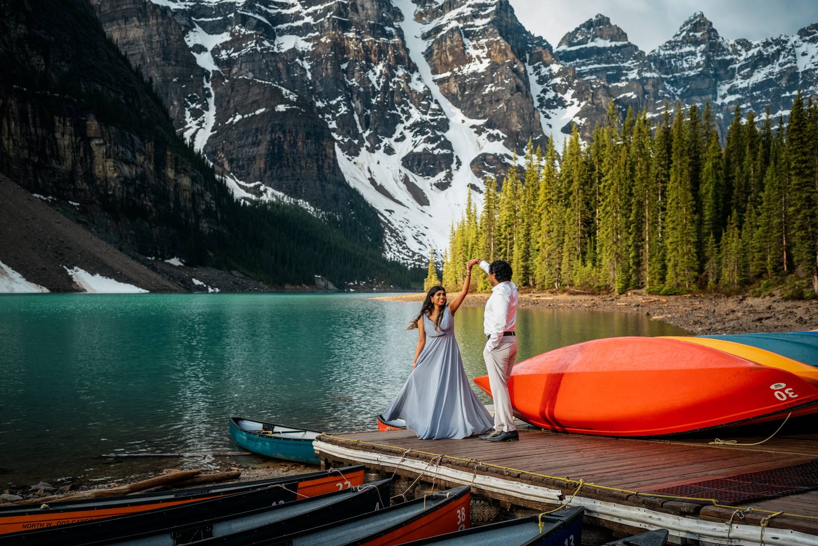 couple dancing at moraine lake