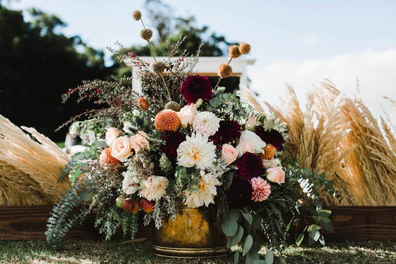 Burgundy and Mustard Color Palette Ceremony Flower Arrangements