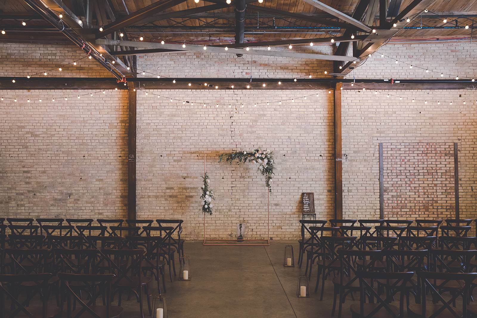 crossback chairs, ceremony, ceremony chairs, ceremony arch ideas, cafe lights, industrial chic cerem