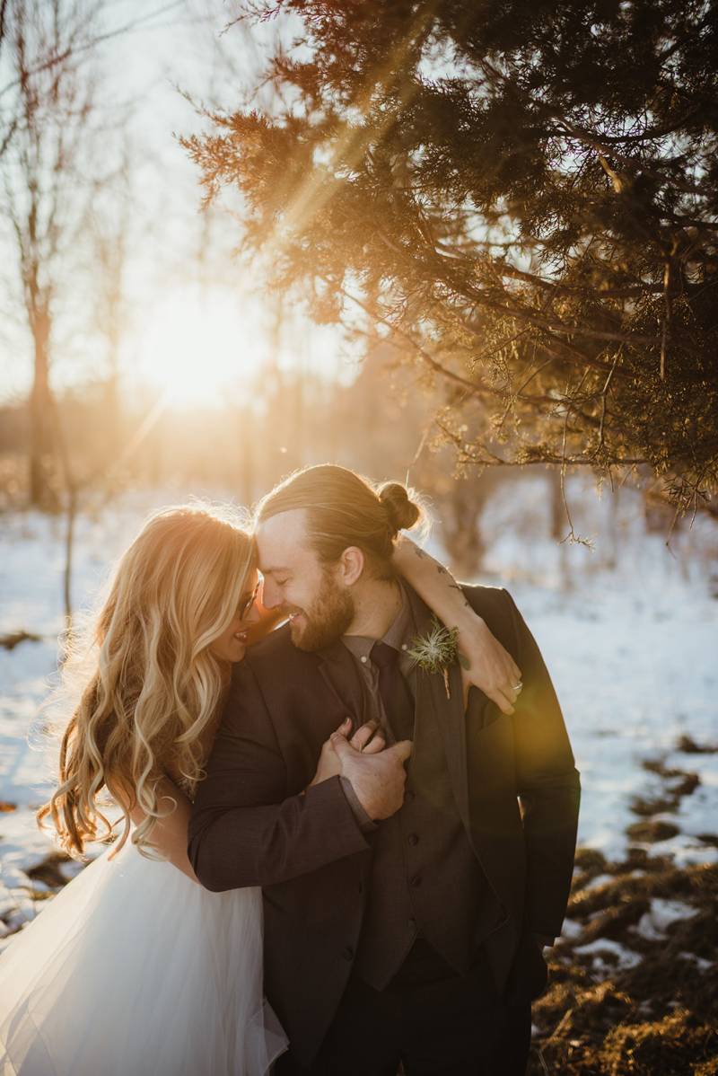 golden hour sunset bride and groom photos, snowy winter woods wedding