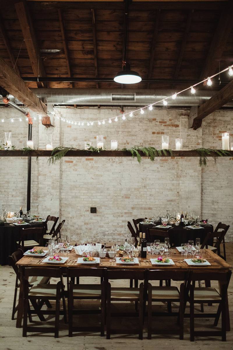 industrial warehouse wedding reception, harvest tables, head table, kings table, cafe lights, hangin
