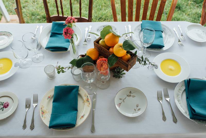 farm chic wedding wisconsin vintage rentals chairs mix n' match vintage plates table settings orange