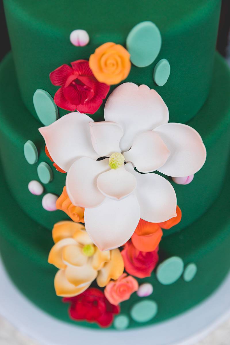 bright pops of color green floral wedding cake