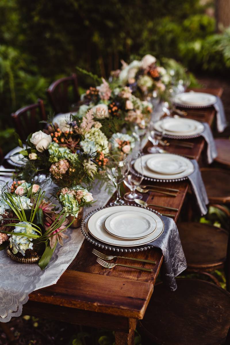 wedding table setting  in the forest fairytale wedding in the woods
