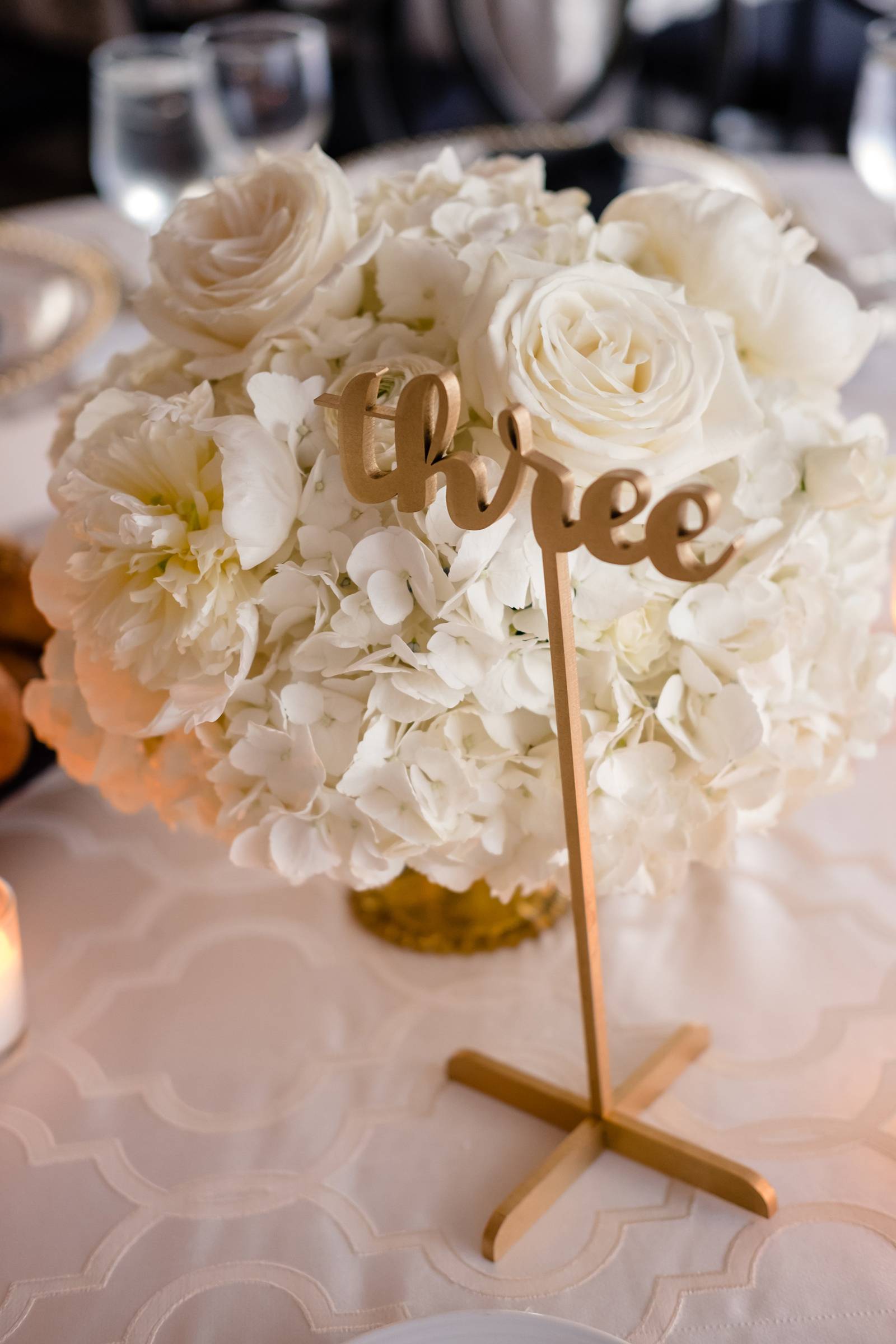 gold calligraphy laser cut table numbers, white floral centerpiece, centerpieces, hydrangeas centerp