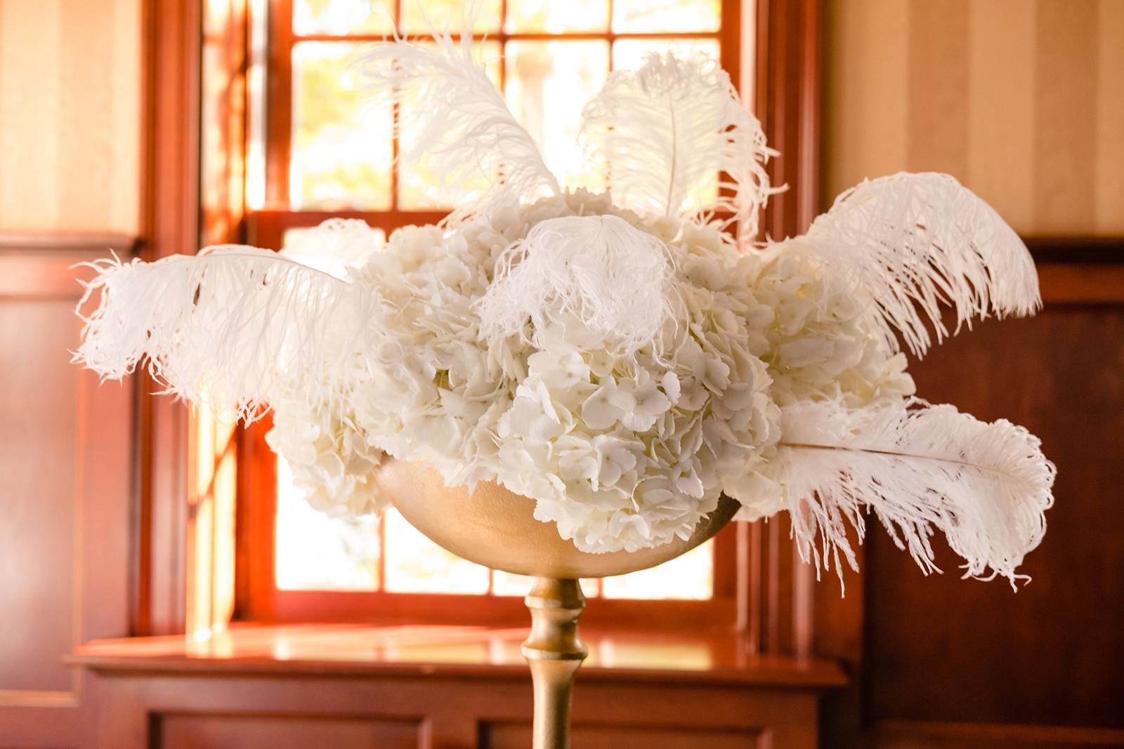 old hollywood gatsby glam centerpieces, white feather floral centerpieces, tall white hydrangeas cen