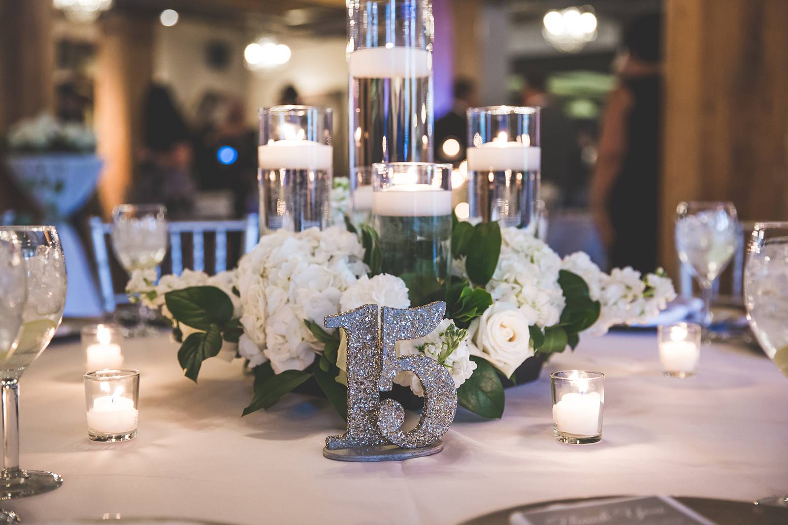 silver white wedding table reception, silver table numbers, hydrangea centerpieces