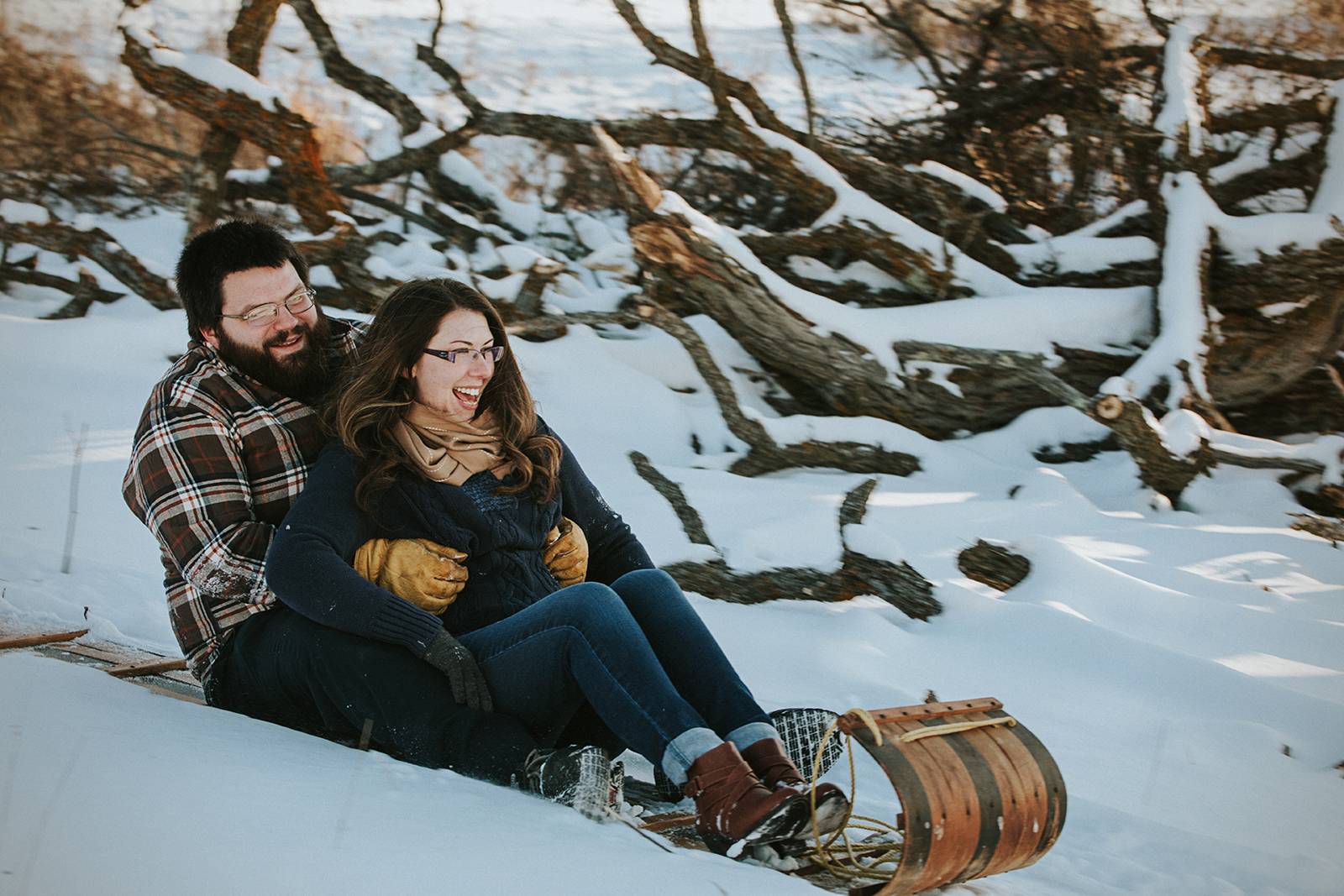 snowy sleigh ride engagement session