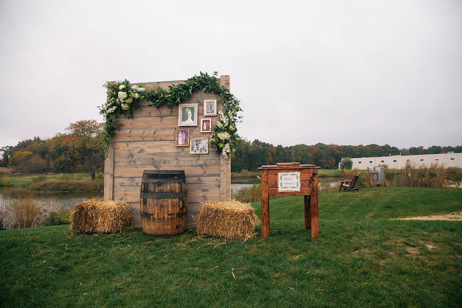 ceremony arch, ceremony backdrop, decor, ceremony wedding greenery garland, outdoor ceremony, haybal