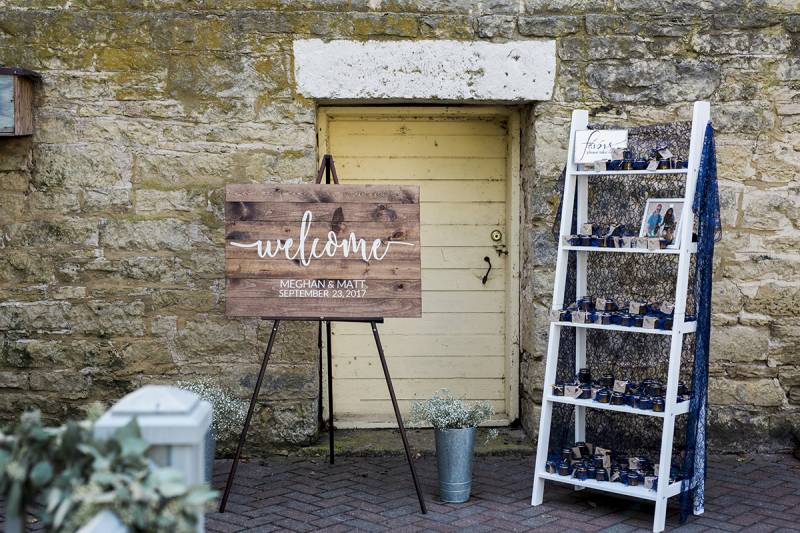 welcome wedding sign, potted plants, guest favor table, guest favor station stand