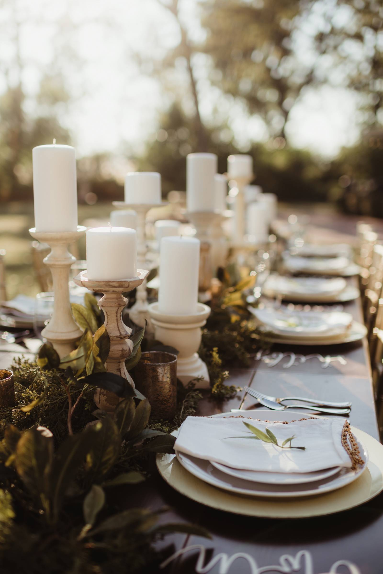 white candles, table setting, table settings, greenery, al fresco dining, table decor, place card fl