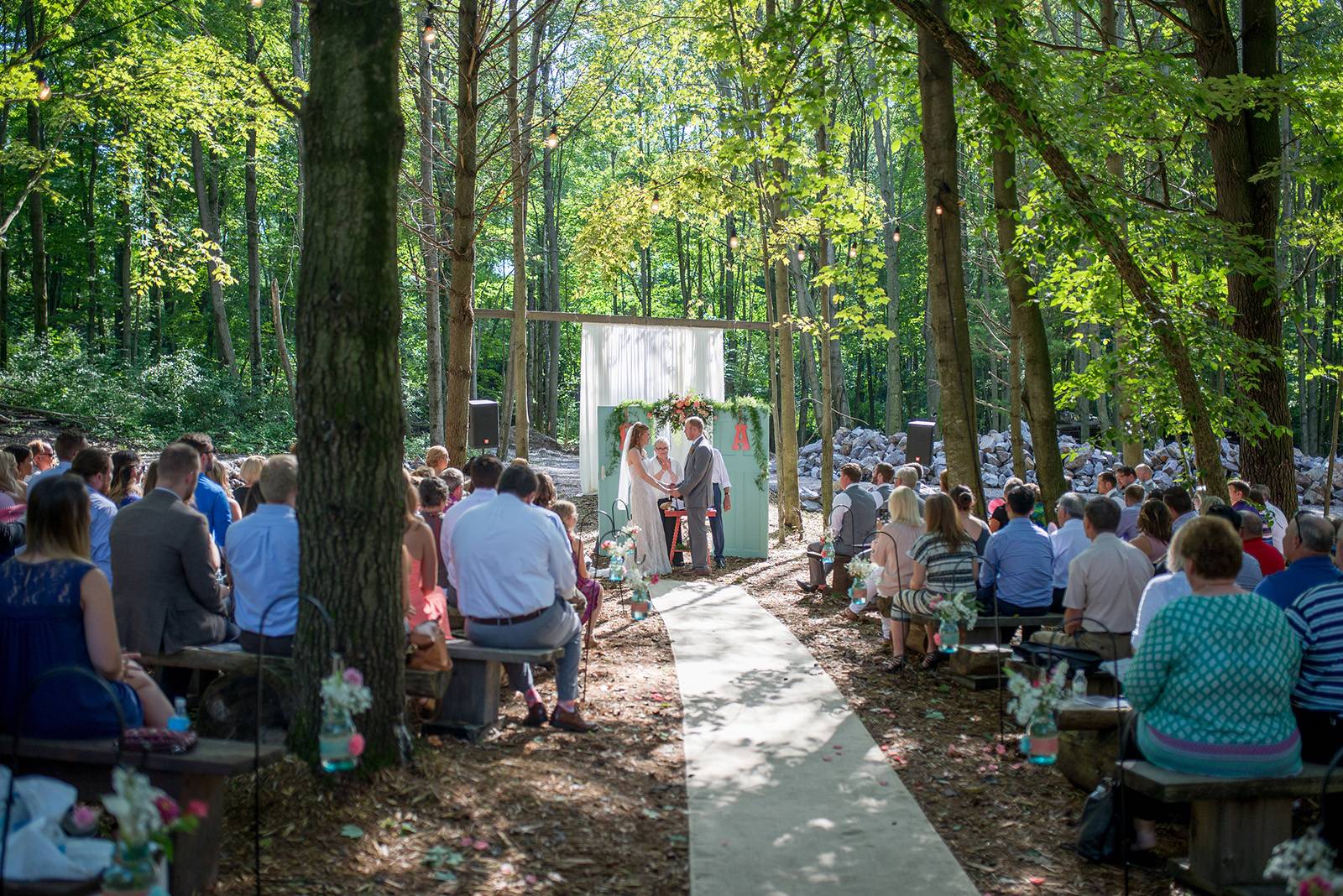 whimsy woodland woods forest wedding, outdoor ceremony, rustic whimsical ceremony arch, ceremony ent