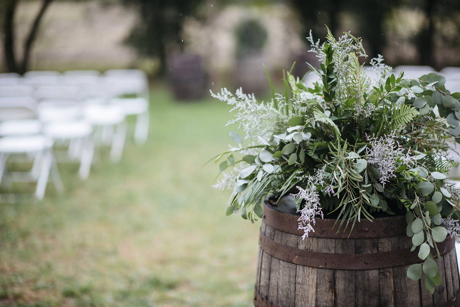 ceremony flowers, whiskey barrel