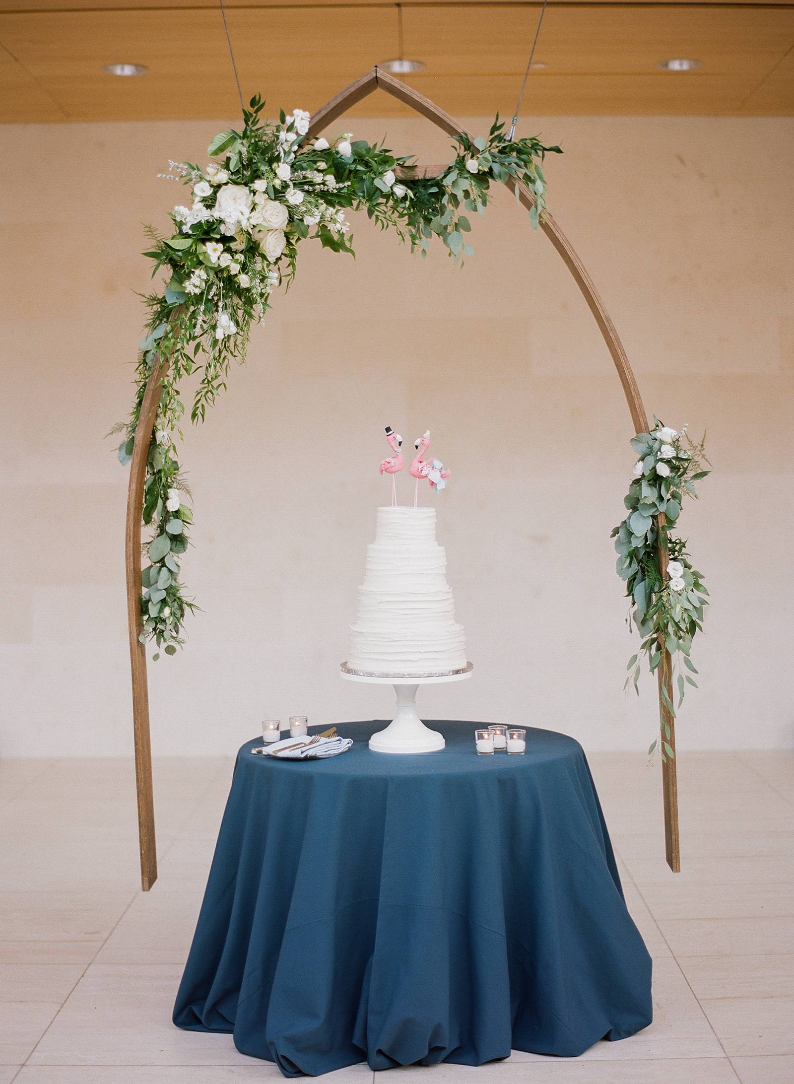 white cake arch display, hanging floral arch installation,
