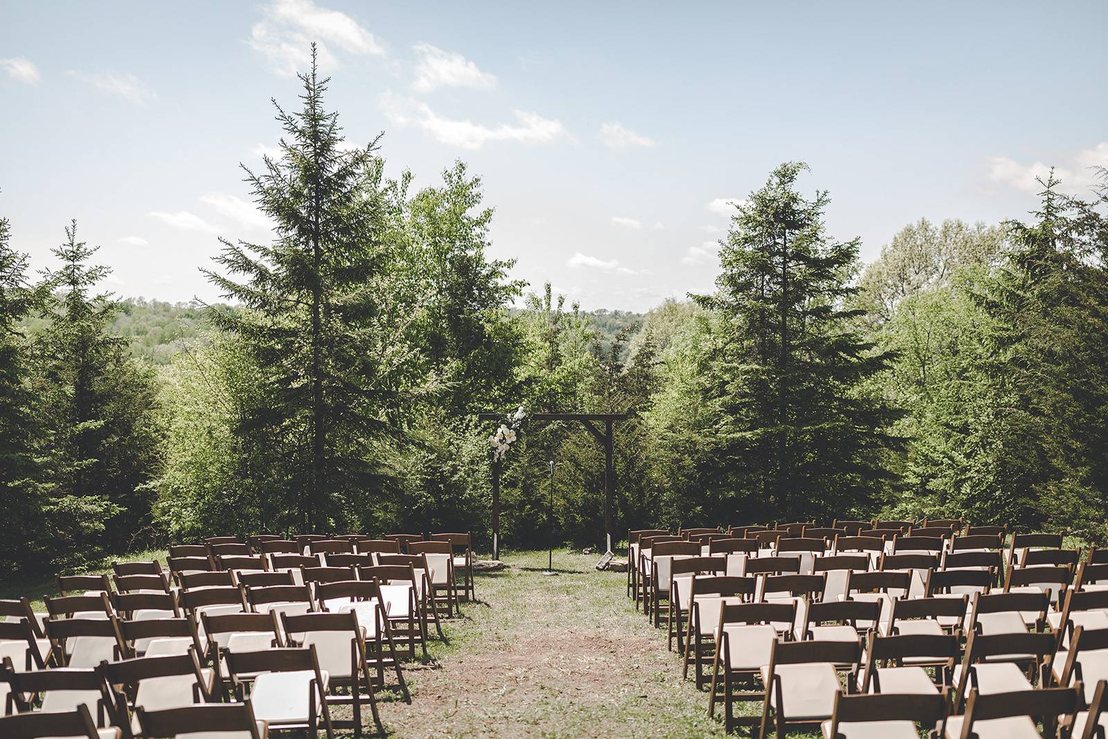outdoor wedding in the woods ceremony